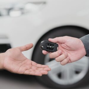 a locksmith giving a customer their duplicate key
