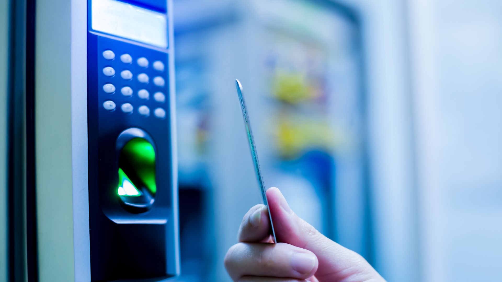 person with a key card tapping a lock