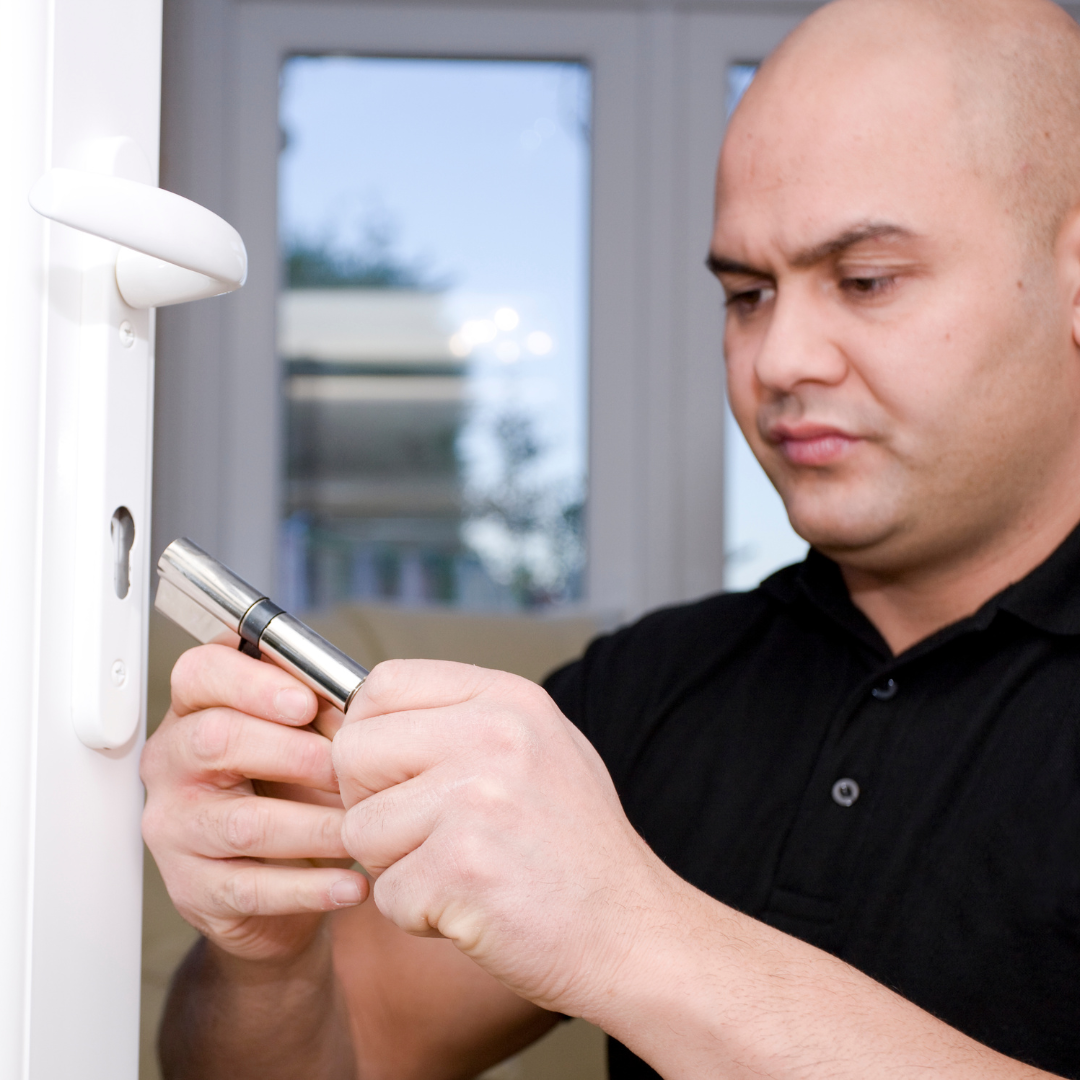 a lock smith replacing a lock