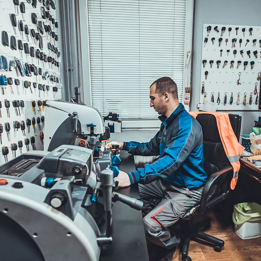 a locksmith working on a transponder for a car