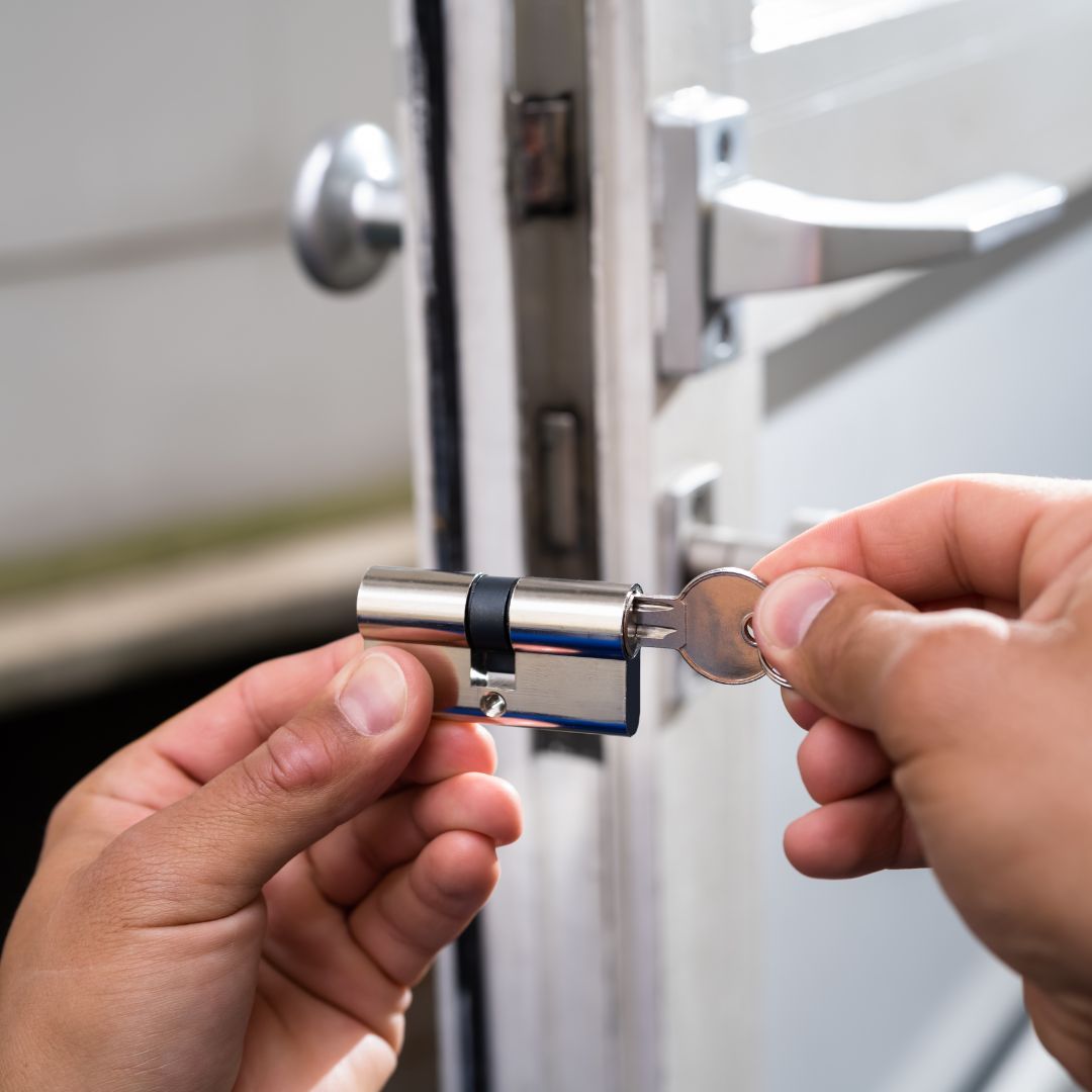 A master locksmith rekeying a lock