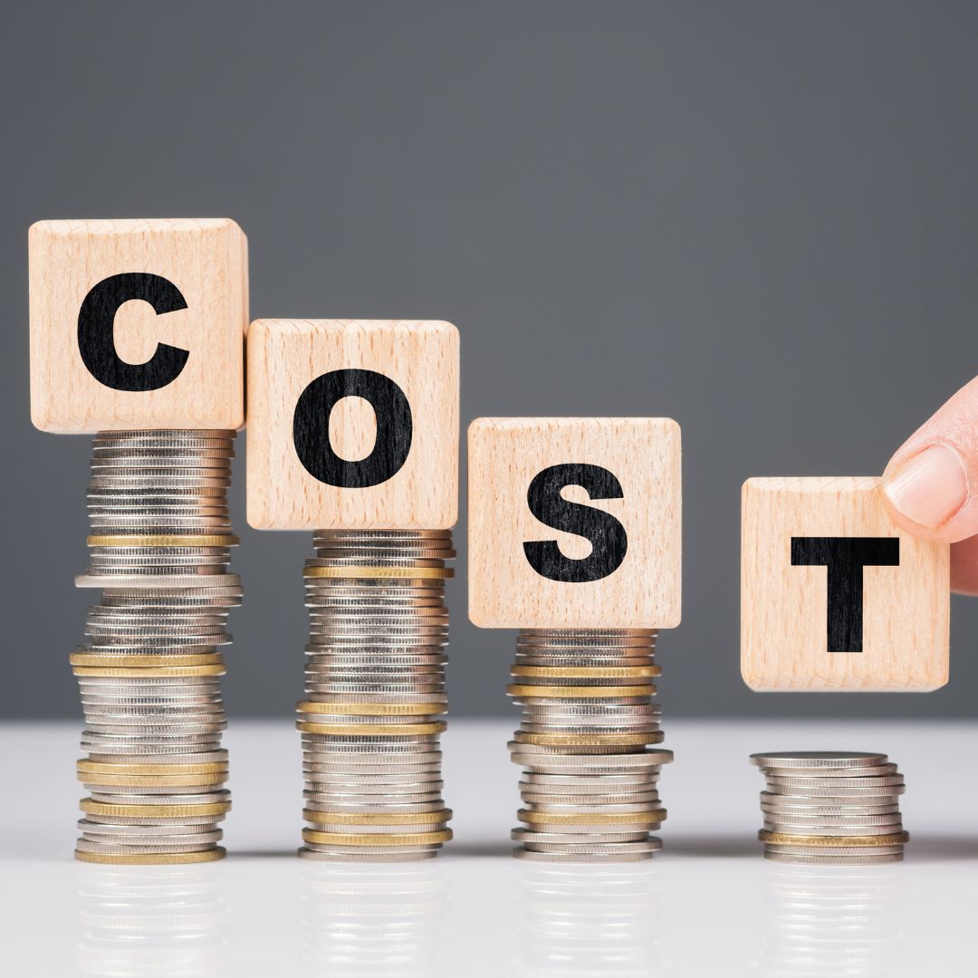 Wooden blocks reading "Cost"