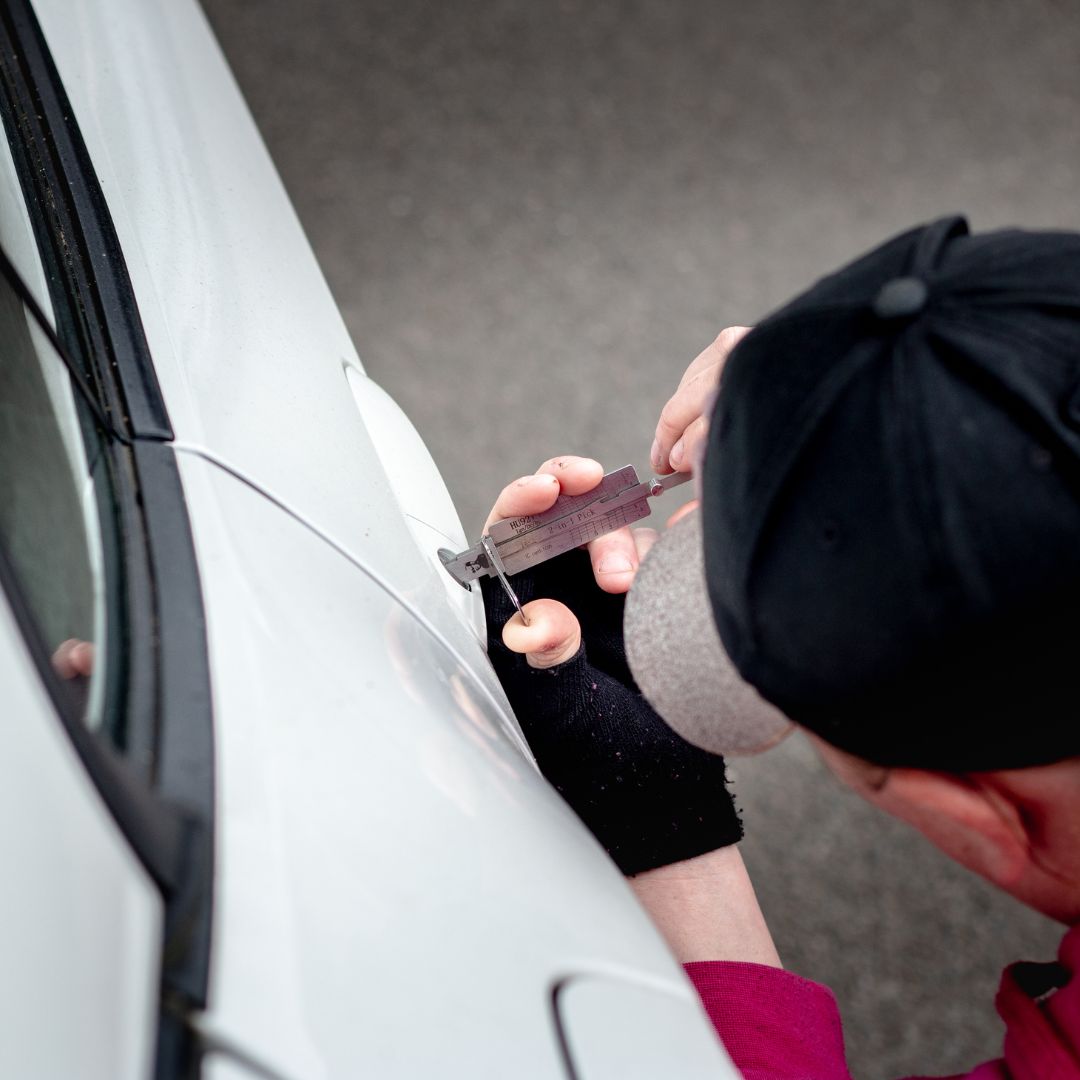 Locksmith working on car lock