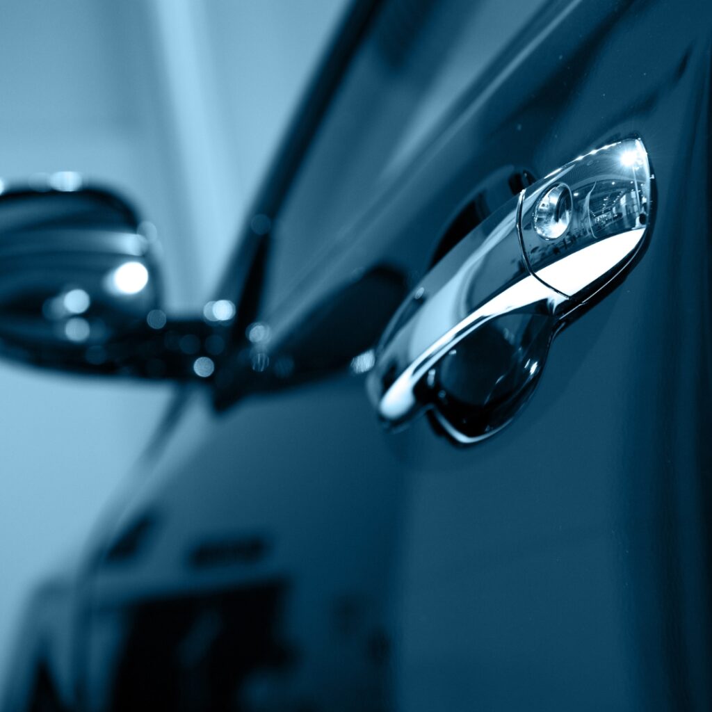 Close-up of a car door handle.